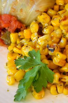 corn on the cob with cilantro and parsley garnishes