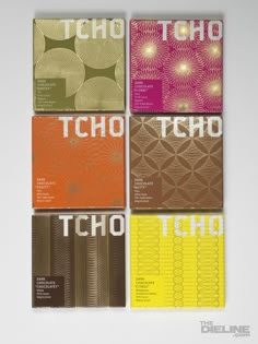 four books with different colors and designs on the covers, all in different font styles