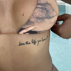 a woman's stomach with the words live the life you love written on it