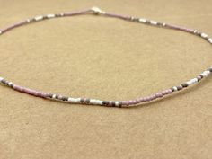 Czech Seed Bead Necklace, bead size 2.1mm (11/0), 18 inches long (#SB0062).  You will receive the exact necklace in this photo. The cord of this necklace is tarnish resistant steel wire coated in nylon.  It is 18 inches long. Clasp is zinc alloy with silver tone that is both lead and nickel free. Made in a smoke free home. Shipping is free and done through USPS. We can not accept refunds on this item. Purple Seed Bead Necklace, Laura May, Necklace Bead, Leaf Crafts, Seed Bead Necklace, Beaded Necklaces, Star Necklace, Bead Necklace, Seed Bead