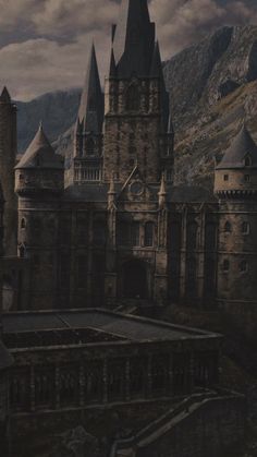 an image of a castle with mountains in the background