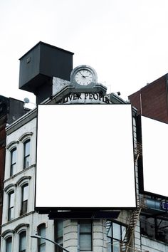 an outdoor billboard with a clock on top