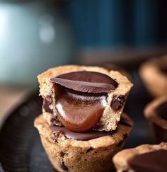 there is a chocolate cupcake on the plate