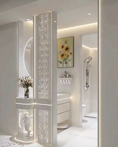 a white bathroom with sunflowers on the wall and mirror in the corner,