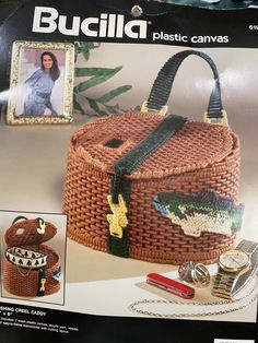 an image of a basket with fish on it and other items around it, including a watch