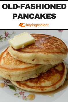 pancakes stacked on top of each other with butter and syrup in front of the caption