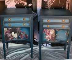 two blue nightstands with flowers painted on the front and sides, side by side