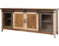 a large wooden cabinet with sliding doors