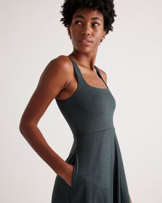 The definition of effortlessly cool, our fit and flare style is as easy to wear as it is fashionable. The midi length and pockets are designed to flatter every shape while the lightweight blend of recycled polyester and a touch of spandex feels buttery soft. Not to mention its moisture-wicking properties and 4-way stretch leave you feeling extra comfortable. Trust us, you’re going to want to wear this dress everywhere you go.  | Quince | Women's Flowknit Breeze Fit & Flare Dress in Heather Green Casual Solid Color Midi Dress In Elastane, Everyday Stretch Midi Dress, Fitted Midi-length Dress For Everyday, Ruched Waist Dress, Boyfriend Cardigan, Heather Green, Linen Short, Recycled Yarn, Athletic Wear