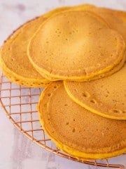 four pancakes sitting on top of a wire rack