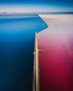 an aerial view of the blue and red water