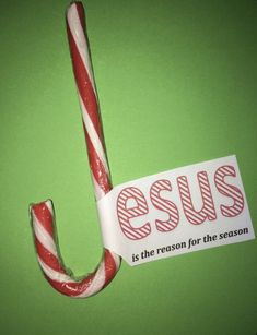 a candy cane with the words jesus is the reason for the season