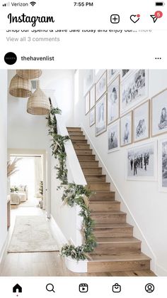 the stairs are decorated with greenery and pictures