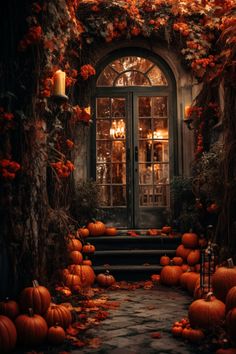 pumpkins on the ground in front of a doorway