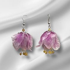 Beautiful clear cold porcelain tinted with lilac, and beads created an unique and one kind earrings. Silver tone hardware used to finish. It will look beautiful with any outfit in any occasion. Earring with theirs sparkles will highlight the sparkling of your eyes. Handmade and unique they will bring you joy and brighten your image. Spring Daffodils, Unique Handmade Earrings, Handmade Earring, Spring Tulips, Cold Porcelain, Czech Beads, Earrings Silver, Daffodils, Handmade Earrings