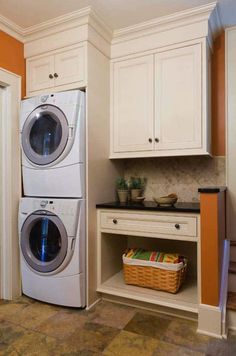 a washer and dryer in a small room