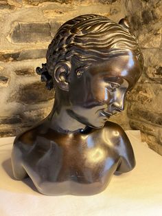 "Beautiful bronze effect plaster bust of \"La Rieuse\" after Jean Baptiste Pigalle made in c1970's. In good condition, she does have a few marks commensurate with age and a chip to her left ear (please see photos) but overall she really is beautiful when displayed (I haven't cleaned the dust from her hair!) She measures approximately 34cm high and a width of approx 30cm. She weighs approx 2.8kg so would not be suitable for overseas postage, although I would be happy to give a quote if you are in Glass Mushrooms, Royal Crown Derby, Jean Baptiste, Crown Royal, Beautiful Vase, Fine Art Ceramics, Her Hair, See Photo, Magnolia