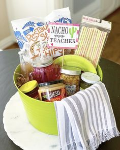 a green bucket filled with food on top of a table