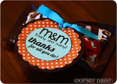 an orange and white polka dot tag with a blue ribbon on it that says, mom thank you many thanks for all you do