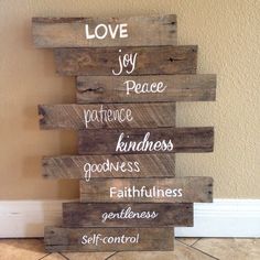 a wooden sign that says love, joy, peace, kindness, goodness, godness, self - control