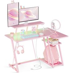 a pink computer desk with two monitors and headphones on it, sitting in front of a white background