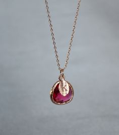 "This beautiful ruby necklace would be a perfect gift for a wedding, birthday, anniversary, graduation or for any occasion. Please click here to view the matching earrings: https://www.etsy.com/listing/751674821/ruby-earrings-july-birthstone-gift-july?ga_search_query=ruby&ref=shop_items_search_3&pro=1&frs=1 The rose gold, gold or silver plated ruby pendant is made of glass and is a gorgeous red shade that has dark pink hues in certain light. It measures approximately 12.5x 16 mm and Pink Birthstone Necklace For Anniversary, Rose Gold Teardrop Ruby Jewelry, Ruby Birthstone Necklace As Gift, Rose Gold Ruby Jewelry For Parties, Personalized Red Jewelry For Birthday Gift, Red Birthstone Jewelry For Birthday Gift, Elegant Red Birthstone Necklace For Gift, Elegant Red Birthstone Necklace Gift, Rose Gold Birthstone Jewelry For Birthday