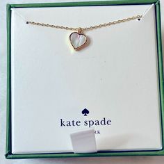 White Colored Stone, Yellow Tone Necklace Comes With Box, Box Does Have A Cut Across The Bottom White Box-shaped Jewelry Gift, Kate Spade Necklaces With Adjustable Chain As Gift, Kate Spade Necklace With Adjustable Chain, Kate Spade Necklace With Adjustable Chain For Gift, White Jewelry With Gift Box For Birthday, Kate Spade Jewelry With Adjustable Chain For Gifts, Kate Spade White Jewelry For Anniversary, Gold Box-shaped Jewelry For Valentine's Day, White Heart-shaped Jewelry Gift