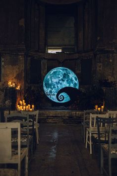 the inside of a restaurant with tables and chairs set up in front of a full moon