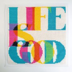 a cross - stitch pattern with the words life is good in multicolored letters