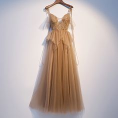 Tulle Gown With Spaghetti Straps For Prom, Tulle Ball Gown With Spaghetti Straps For Parties, Spaghetti Strap Tulle Ball Gown For Parties, Spaghetti Strap Gown For Prom Season Banquet, Tulle Banquet Dress With Spaghetti Straps, Tulle Dress With Spaghetti Straps For Banquet, Gold Maxi Dress With Spaghetti Straps For Prom, Gold Spaghetti Strap Maxi Dress For Prom, Tulle Evening Dress With Spaghetti Straps