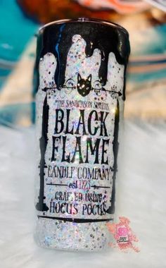 a black and white can with glitter on it