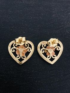 These beautiful and feminine heart-shaped 14K earrings are made in yellow gold with a rose gold heart in the center of each.  These have push backs for easy on and off.  Very classic earrings that tell her you love her. Luxury Yellow Gold Earrings With Heart Charm, Rose Gold Heart Pendant Earrings For Anniversary, Gold Heart-shaped Flower Earrings, Rose Gold 14k Heart Pierced Earrings, Rose Gold 14k Pierced Heart Earrings, Rose Gold 14k Heart Earrings, Gold Flower Earrings For Anniversary On Valentine's Day, Gold Flower-shaped Earrings For Valentine's Day, Gold Flower Earrings For Valentine's Day Anniversary