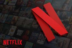 the netflix logo is shown in front of a wall of movies