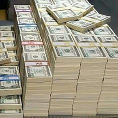 stacks of money are stacked on top of each other