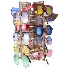 Form meets function with this wall hanging Medusa sunglasses organizer. Display your sunglasses while keeping them organized and accessible. Made of Walnut Veneer with an MDF wood core. Holds up to 15-pairs of sunglasses and eyeglasses. Includes: - Medusa Sunglasses Organizer (Fully Assembled) - Wall mounting bracket - 2 screws & 2 drywall anchors - 3/16" drill bit for installing drywall anchors Dimensions: 12" Tall, 8.25" Wide, 7.75" Deep Note: Sunglasses not included. Installing Drywall, Sunglasses Rack, Medusa Sunglasses, Sunglasses Organizer, Drywall Anchors, Wood Core, Wall Organization, Walnut Veneer, Wall Mounting