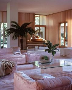 a living room filled with furniture and a piano