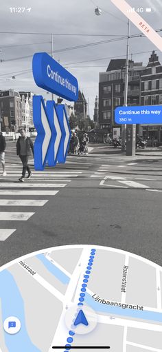 an image of a street map with people walking on the sidewalk and buildings in the background