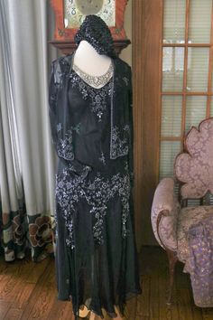 Black silk chiffon beaded Flapper dress, approx sizing from 4-8 (bias cut) Gown does include the matching beaded jacket. More pics on FB:https://www.facebook.com/pg/RetroVintageWeddings1920s1930s/photos/?tab=album&album_id=2623216997774327 Elegant Festive Flapper Dress For Evening, Elegant Festive Flapper Evening Dress, 1920s Embellished Black Dress, 1920s Black Embellished Dress, Black Art Deco Wedding Dress, Black Sequin Flapper Dress For Wedding, Glamorous Black Flapper Dress For Wedding, Black Art Deco Embellished Dress, Black Flapper Dress For Wedding