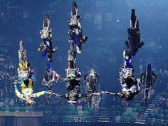 multiple images of people doing tricks in the air at a sporting event with spectators watching