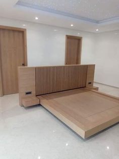 an empty room with wooden furniture in it