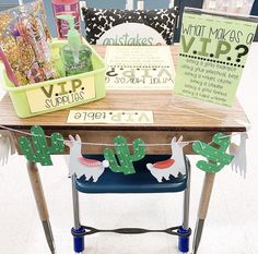 a wooden table topped with lots of items on top of a blue chair next to a sign that says what makes up?