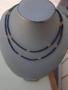 "Lapis fact rondelle 4mm beaded necklace 40\". with golden pyrite beads and silver spring clasps with gold polish. semiprecious beads color: blue and golden. beautiful ready to wear." Gold Lapis Lazuli Necklace With Faceted Beads, Gold Lapis Lazuli Faceted Beads Necklace, Gold Gemstone Beaded Rondelle Necklaces, Gold Rondelle Beaded Necklaces With Gemstone Beads, Gold Rondelle Gemstone Beaded Necklace, Gold Rondelle Beaded Necklace With Gemstone Beads, Black Pearl Jewelry, India Necklace, Black Beaded Jewelry