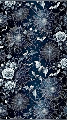 a black and white pattern with roses, spider webs and bats on it's surface