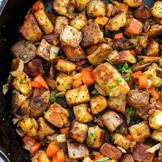 cooked potatoes and carrots in a skillet