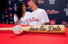 a baseball bat and ball sitting on top of a table