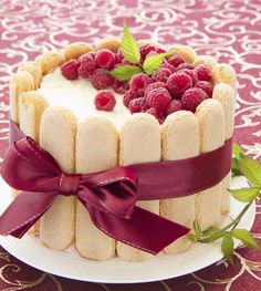 a cake decorated with fresh berries and icing