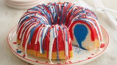 a red, white and blue bundt cake on a plate with a slice cut out