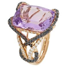 Introducing the exquisite 9.71 Amethyst Ring, adorned with shimmering white brilliant cut diamonds and captivating black diamonds, all nestled in a luxurious 18 Karat Rose Gold setting. This magnificent piece seamlessly combines elegance and allure, making it a must-have addition to your jewelry collection. At the heart of this ring lies a stunning 9.71 Amethyst, displaying a pastel purple hue that symbolizes royalty and sophistication. Surrounding the amethyst are white brilliant cut diamonds, Violet Pastel, Ring Rosegold, Black Diamond Ring, Rose Gold Band, Black Diamonds, Pastel Purple, Belleza Natural, Amethyst Ring, Brilliant Cut Diamond