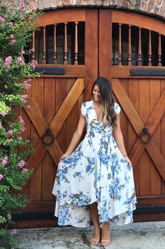 Wedding season's favorite high low midi dress. Romantic blue and green flowers dance across the white backdrop, making this dress perfect for a formal evening event. Bridesmaids will love the capped sleeves and full skirt. This versatile dress will compliment your wedding colors and ideas. #lovelulus