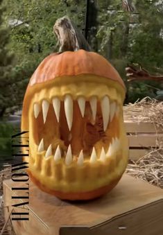 a carved pumpkin with teeth and fangs on it